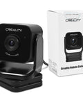 Nebula Camera For 3D Printer Monitoring With Night Vision And WiFi 24 Hour Live Print View Time Lapse Video USB Connect Compatible With Sonic Pad Nebula Pad Ender 3 V3 Series CR 10 SE Halot Mage Pro front view beside packaging