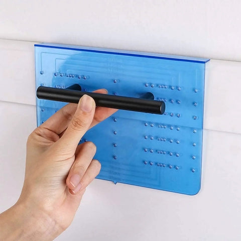 Hand using Cabinet Handle Drill Template Kit With Knob And Pull Templates And Three Sixteenth Inch Drill Bit on wall