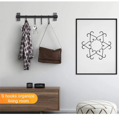 Heavy Duty S Shaped Hooks For Hanging Pots And Pans Plants Cups Coats And Towels In Kitchen Bedroom Office Garden And Bath Matte Black 10 Pack Durable Aluminum Rust Resistant Multipurpose Everyday Use displayed in a living room.