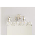 Three Light Coastal Vanity Light With Clear Glass Shades In Polished Nickel Finish For A Modern Beachy Bathroom Glow And Vibe