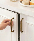 Hand opening cabinet with Ten Pack 5 Inch Antique Brass Cabinet Pulls For Kitchen Cabinets And Bathroom Vanities, Vintage Retro Drawer Handles