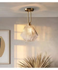 Nordic Led Gold Pendant Light Diamond Glass Lighting Fixture for Kitchen Island Living Room Hallway,for Household Entry, hanging above a plant.