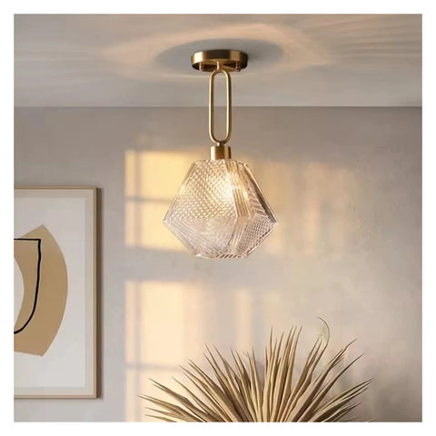 Nordic Led Gold Pendant Light Diamond Glass Lighting Fixture for Kitchen Island Living Room Hallway,for Household Entry, hanging above a plant.