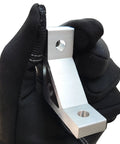 Gloved hand holding Heavy Duty 2020 Aluminum Extrusion Corner Bracket from Connectors Kit