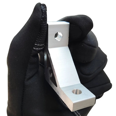 Gloved hand holding Heavy Duty 2020 Aluminum Extrusion Corner Bracket from Connectors Kit