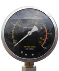 Rugged Gearhead Favorite 12 Ton Manual Hydraulic Shop Press gauge showing metric and US tons on a black background.