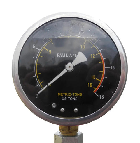 Rugged Gearhead Favorite 12 Ton Manual Hydraulic Shop Press gauge showing metric and US tons on a black background.