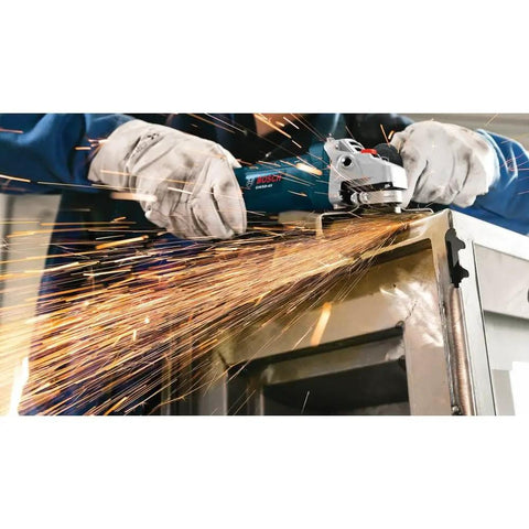 Person using Powerful 7.5 Amp 11000 RPM Four And One Half Inch Angle Grinder With Slim Grip on metal surface