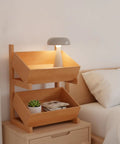 Solid Wood Two Tier Storage Shelf With Smooth Tilt Trays Warm Brown Finish Compact Floor Rack For Books And Gear, organized bedside setup.