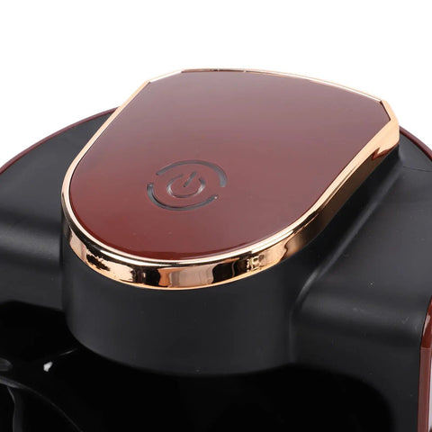 Close-up of the top power button on a Turkish Coffee Maker 250ml Electric Brewer With 550W Fast Heating Cup Included No Fuss Single Serve For Rich Turkish And Greek Style Brews Home Coffee Machine For Hot Beverages.