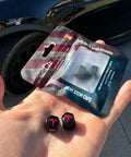Tesla Model 3 S X Y Tire Valve Stem Caps Matte Black Aluminum With Rubber O Rings shown in packaging on hand