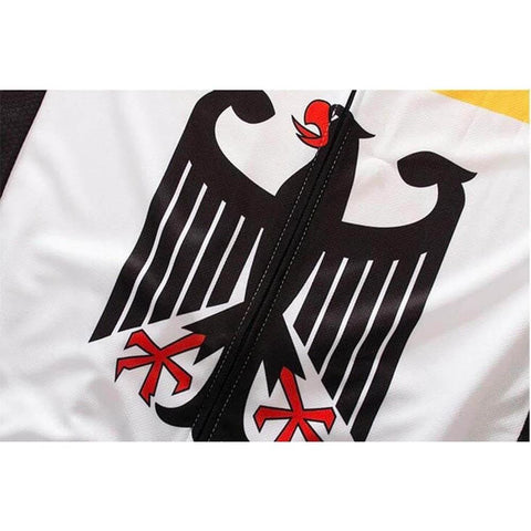 Close-up of a zipper on a garment with a black and red stylized eagle graphic design on a white background.