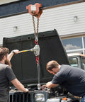 Heavy Duty Cable Come Along Ratchet Winch Hoist With Dual Line Lift, 1.5 Ton Capacity in use for vehicle engine repair