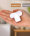 Hand holding one piece of 32 Pack One Half Inch 3 Way PVC Fittings Furniture Grade Elbow Connectors Heavy Duty Budget Friendly Pipe Corner