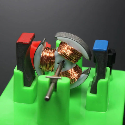 Close-up of Hands On Circuit And Motor Lab Kit for Students DIY DC Motor Model, showing copper coils and plastic components for STEM projects.