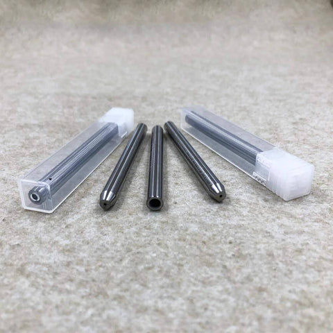 Front view of a six-piece stainless steel water jet nozzle set with clear plastic storage cases