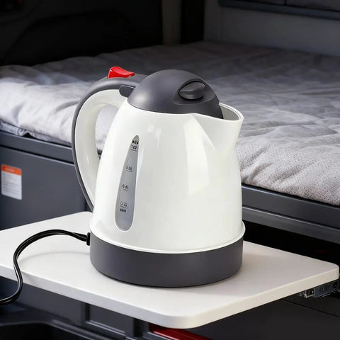 Heavy Duty 24V Electric Kettle For Trucks Built Like A Tank With Auto Shut Off 1 Liter Portable Water Heater on a table.