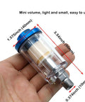 Hand holding small Water Oil Separator Filter Set For Spray Guns And Air Compressors One Quarter Inch NPT Thread Inlet And Outlet
