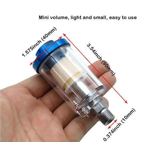 Hand holding small Water Oil Separator Filter Set For Spray Guns And Air Compressors One Quarter Inch NPT Thread Inlet And Outlet