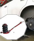 Heavy Duty Airbag Jack For Daily Drivers And Pickups Features Rapid Pump Design With Tough 3 Ton Capacity in garage setting.