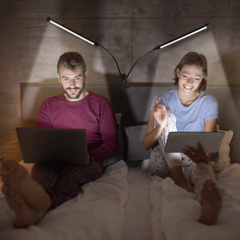 Couple using Dual Head LED Desk Lamp With Clamp, Eye Care Three Color Modes, Five Level Dimming, Clip On Light in bedroom