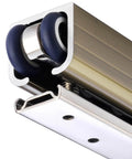 Close-up of Heavy Duty Aluminum Pocket Door Hardware Kit With Quiet Rollers and Eight Wheel Hanger Brackets on ceiling mount track.