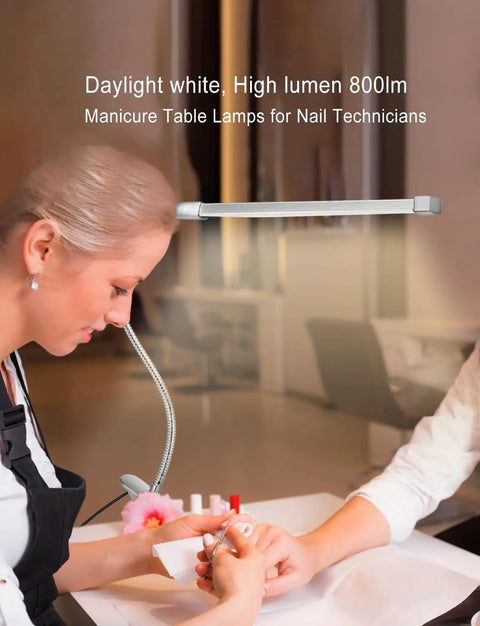 Flexible LED Gooseneck Clip On Desk Lamp With 8W Power used by nail technician for precision lighting at manicure table.
