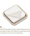 Heavy Duty Self Adhesive Furniture Sliders Eight Piece Pack Square Chair Glides Shielding Carpets Tile Vinyl Hardwood Floors From Scratches With Slick Quick Install Glide Grey, showing an adhesive slider with a beige frame.