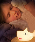 Rechargeable Cute Squishy Shark Night Light For Kids And Teens Soft Silicone Touch Lamp With Gentle Glow next to sleeping child