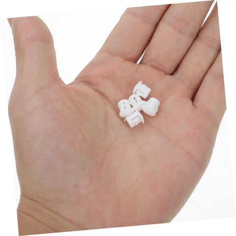 Hand holding 100 Pcs Plastic Hole Plugs White Screw Cap Covers For Cabinets Shelves And Furniture Quick Fix Dust Protection And Reno Boost For Home Office Decor Now