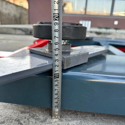 Built like a Tank Heavy Duty Portable Mid Rise Scissor Lift with 6000lbs Capacity, measuring height with a ruler.