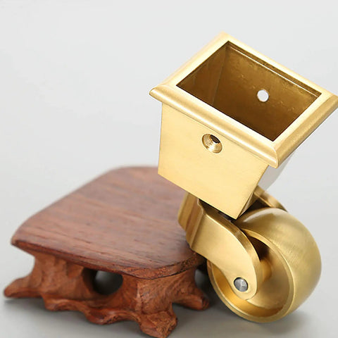 Heavy Duty Solid Brass Caster Wheels For Furniture With 32Mm Square Cup Mount And 360 Degree Swivel Base close-up of caster on wood base.