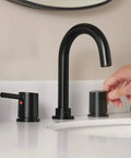 Hand adjusting Precept Widespread Matte Black Bathroom Faucet For 3-Hole 6-16 In. Install With ADA Push Pop-Up Drain