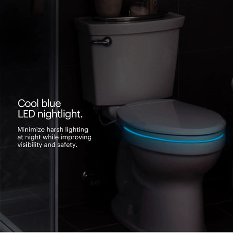 Premium Heated Elongated Toilet Seat With Built In Led Nightlight And Three Warmth Settings in a dark bathroom with cool blue light.
