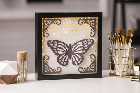 Explore Air 2 Craft Cutting Machine for DIY Home Decor and Apparel, Beginner Friendly, Cuts 100 Materials, Easy To Use, Versatile Craft Cutter In Blue used to cut butterfly design in framed paper art