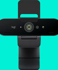 Pro Level 4K Ultra HD Webcam Featuring Swift Auto Focus And Snappy 5X Digital Zoom For Crystal Clear Streams, top view on teal background.