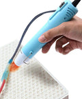 Compact Mini Heat Gun Goes Hard On Sweet Diy Craft Jobs in hand, focused heat on shrink wrap for resin art.