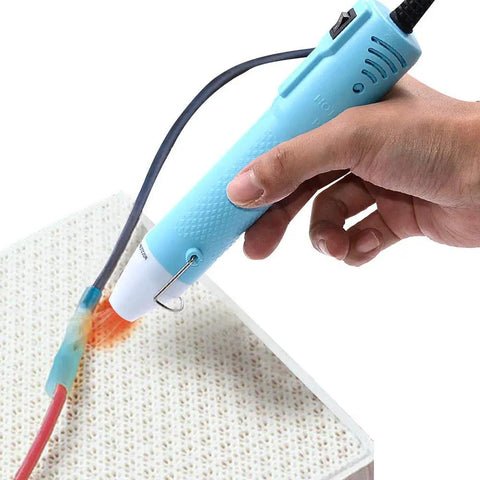 Compact Mini Heat Gun Goes Hard On Sweet Diy Craft Jobs in hand, focused heat on shrink wrap for resin art.