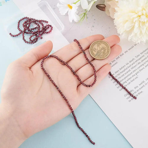 Approximately 270 Pieces 3mm Natural Faceted Garnet Beads For Jewelry Making shown with coin for size comparison.