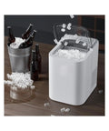 Fast Countertop Ice Maker Portable With Self Cleaning Setup Produces Crisp Cubes In Minutes and delivers ice beside bottles.