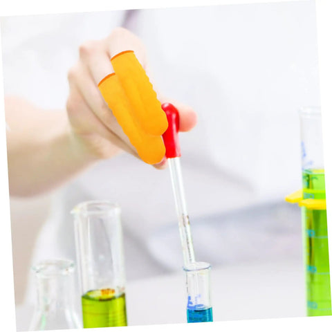 Person using Top Shelf 100 Pack Yellow Latex Finger Sleeves to hold a pipette in a lab setting while mixing liquids.