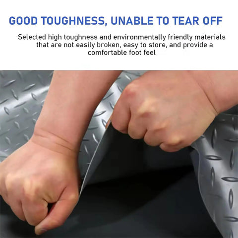 Hands demonstrating durability of Tough As Nails Non Slip Blue PVC Rubber Garage Floor Mat With Diamond Plate Grip