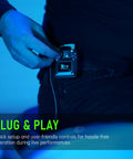 Person adjusting U4 Wireless In-Ear Monitor System beltpack receiver for studio and live gigs, 2.4GHz uncompressed audio setup.