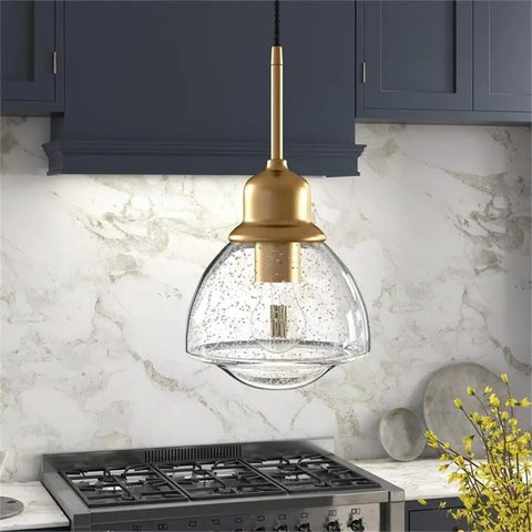 8.12-Inch Wide Pendant Light With Brass Seeded Glass Shade Schoolhouse Bell Style above kitchen stove