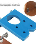 Front view of blue plastic 35mm door drilling jig for concealed hinges with central bore and mounting holes