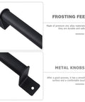 Close-up of a black cast iron cabinet pull in matte finish with mounting plate, highlighting frosting feel and metal knobs.