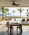 Real Deal Wet Look High Gloss Concrete And Paver Sealer For Exterior Patios Featuring Five Gallon Container on outdoor dining table with view.