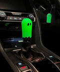Flat Out Smooth Shifting Universal Gear Knob Featuring Glowing Phantom Etching And Contoured Machined Aluminum Handle For Easy Night Cruising Plus Three No Sweat Mount Adapters in dark car interior.