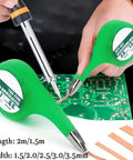 Low Residue No Clean Desoldering Wick Braid 2mm Width 2m Length with thumb wheel dispenser shown on PCB with soldering iron