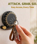 Tough As Nails Two In One Self Adhesive Magnetic Wall Hooks With Heavy Duty Grip No Drill Mount For Clutter Free Kitchen Organization And Safe Metal Storage, black hook holding keys on a smooth wall.